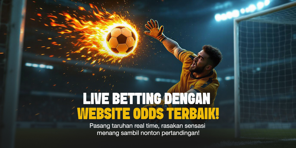 Kiper dengan seragam kuning menyelamatkan bola api yang meluncur deras ke arah gawang saat pertandingan berlangsung di stadion malam hari.